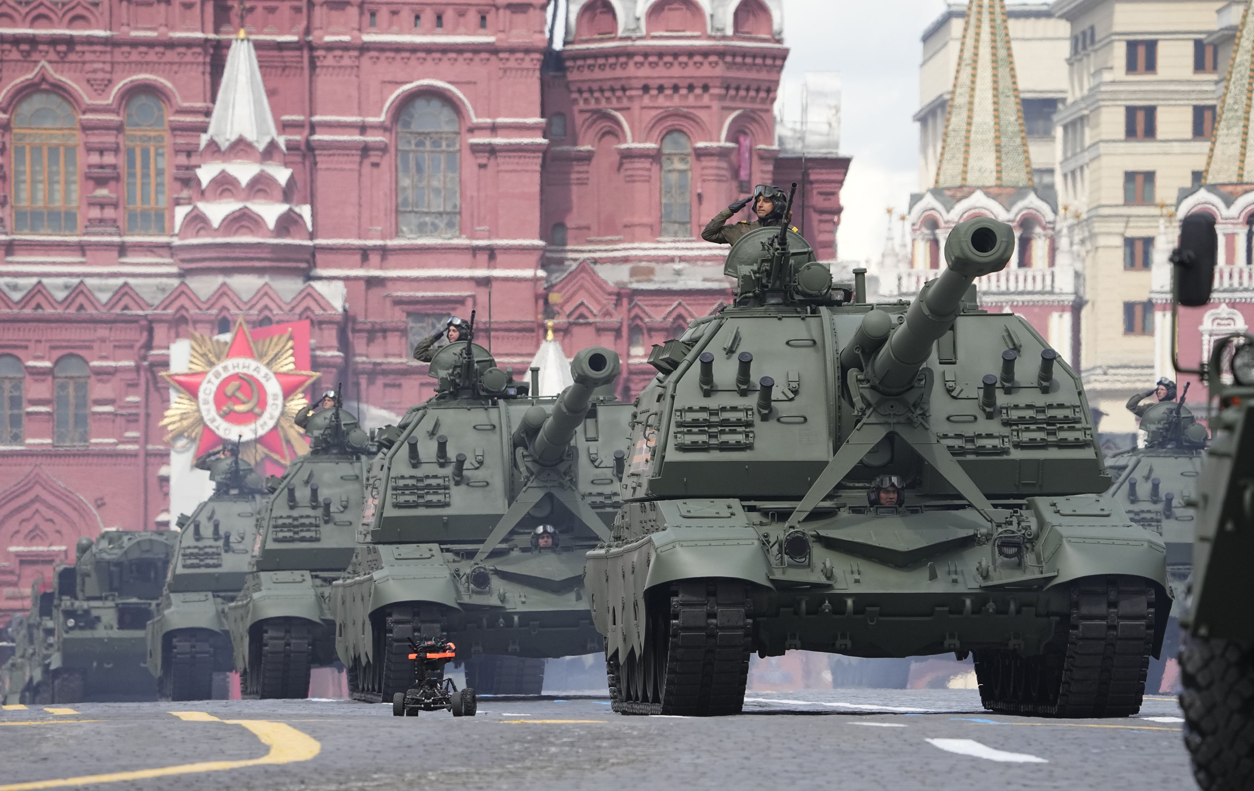 Russian self-propelled artillery vehicles roll during a Victory Day military parade
